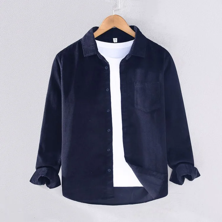 Cotton Corduroy Overshirt — A navy cotton corduroy overshirt worn open over a white tee, hanging on a wooden hanger