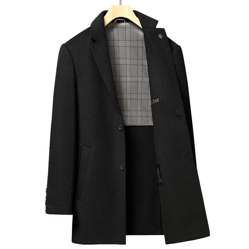 Double-Faced Wool Overcoat — A long black double-faced wool overcoat with notch lapels, photographed on a wooden hanger against a grey wall