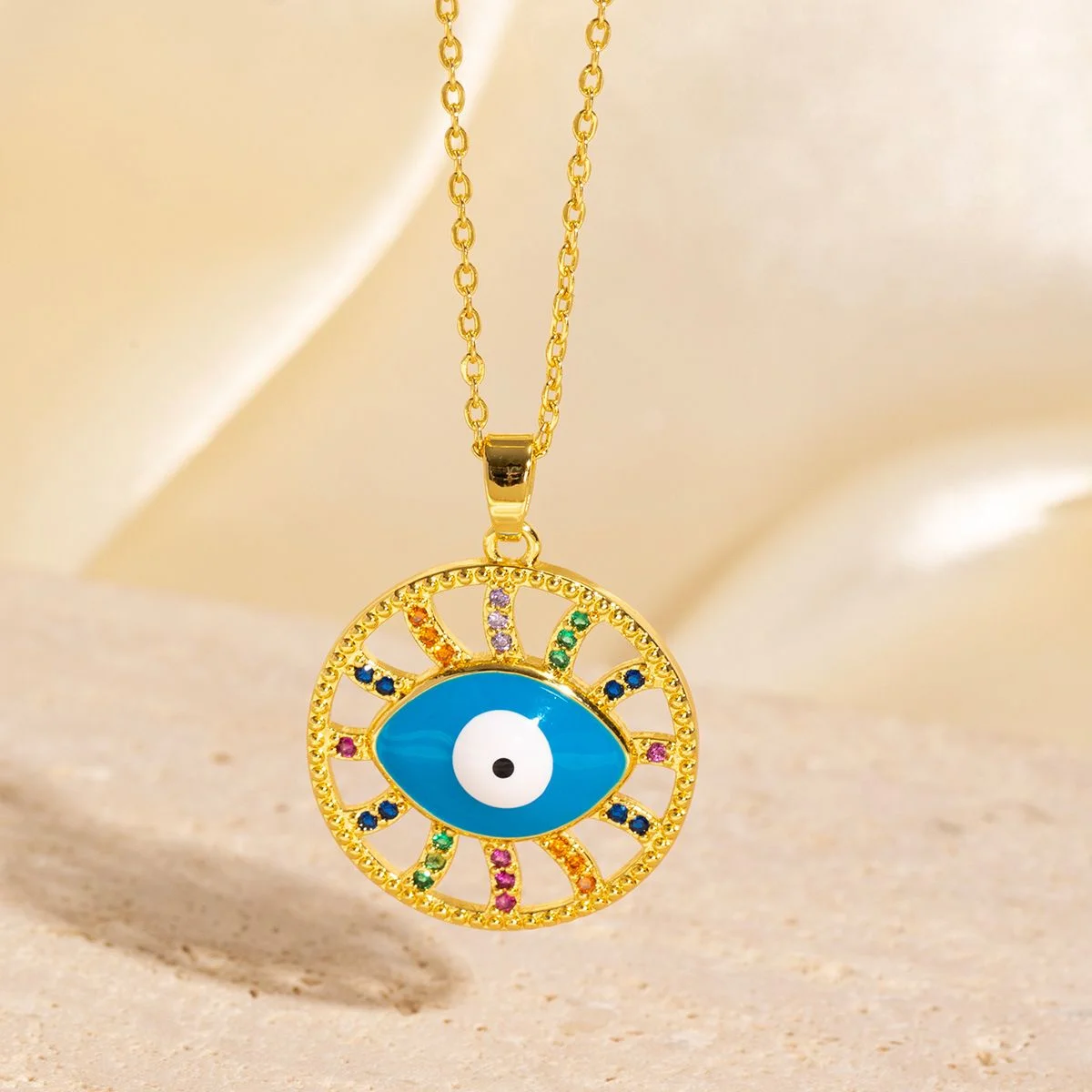 Evil-Eye Pendant Necklace — Gold-tone evil-eye pendant necklaces in blue enamel, crystal, gold and multicolour