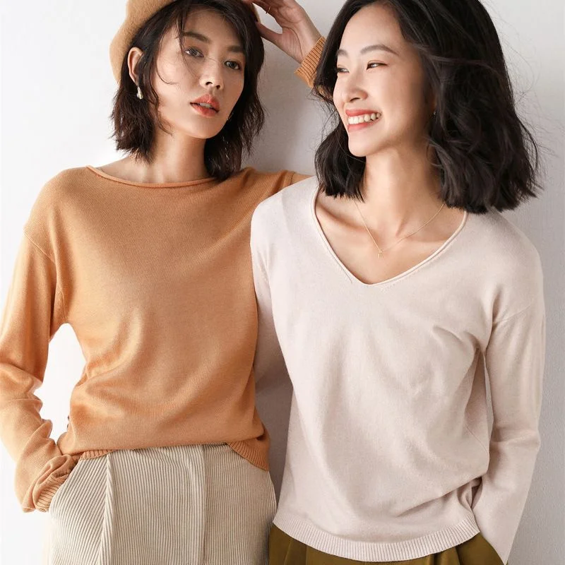 Fine-Gauge Wool-Blend Pullover — A fine-gauge wool-blend pullover with a wide round neck and a V neck, shown on two models in camel, blush, mustard, mint, purple, white and black