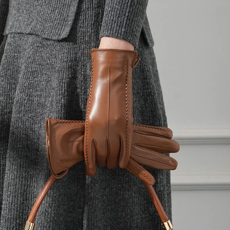 Lambskin Whipstitch Glove — A polished lambskin glove with hand whip stitching along every seam, shown in camel, wine red and black on one hand and as a pair