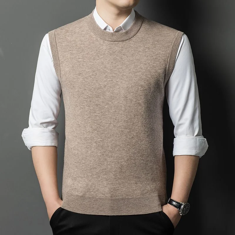 Wool Knit Vest — A fine-gauge wool knit vest with a ribbed collar and armholes, worn over a white shirt in camel, black, charcoal, mid grey, wine and mustard